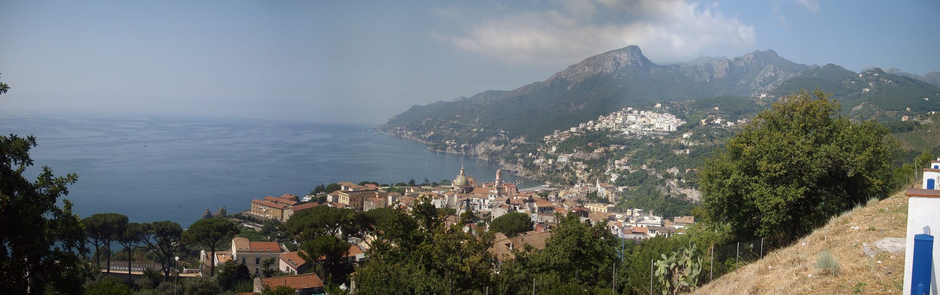 Sunlit Amalfi Coast cliffs and sea — gateway views from a Salerno cruise day